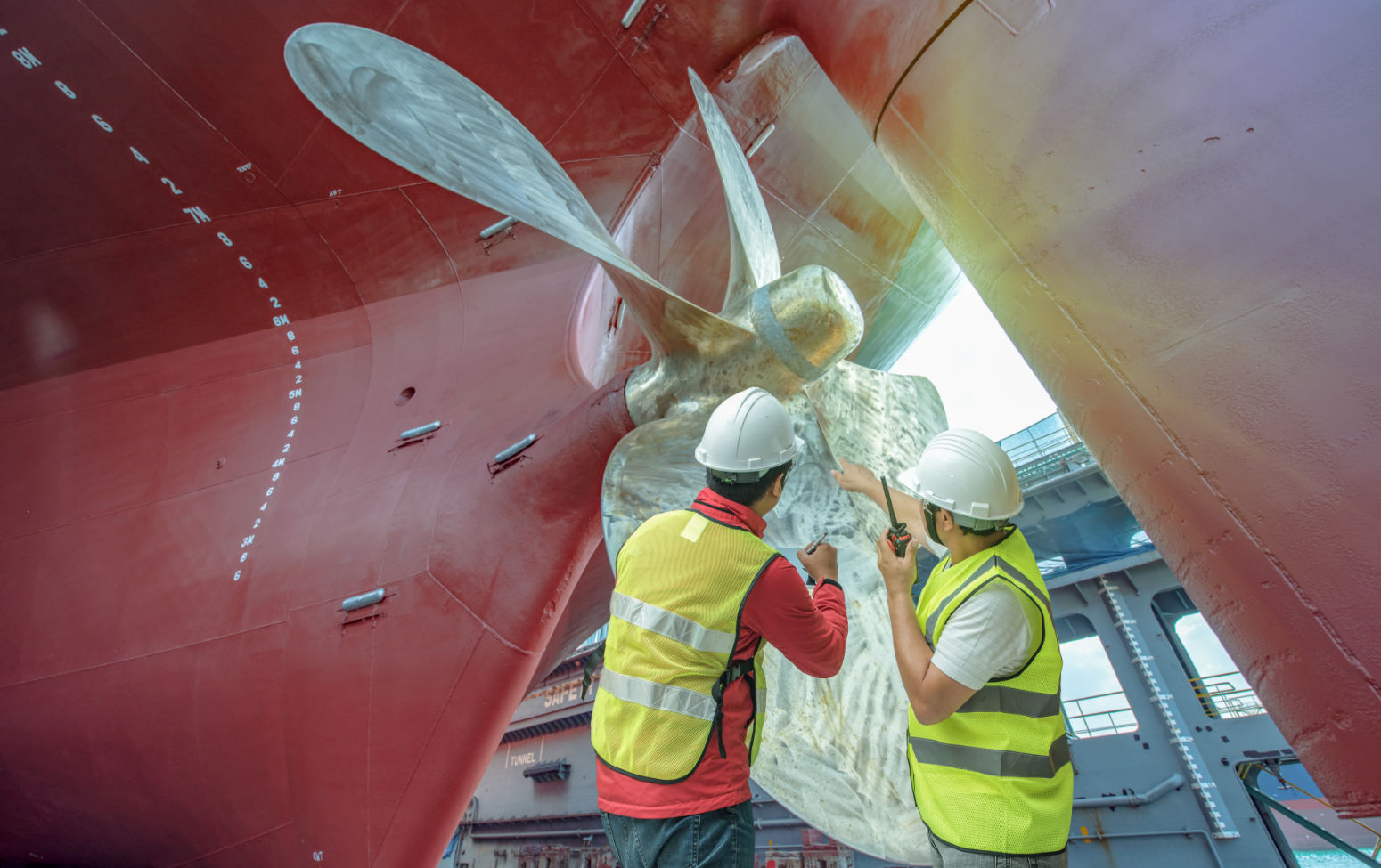 Surveyors inspecting a propellor.